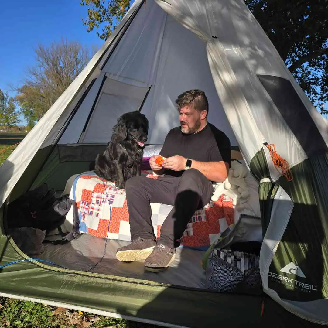 Leon camping with his dog