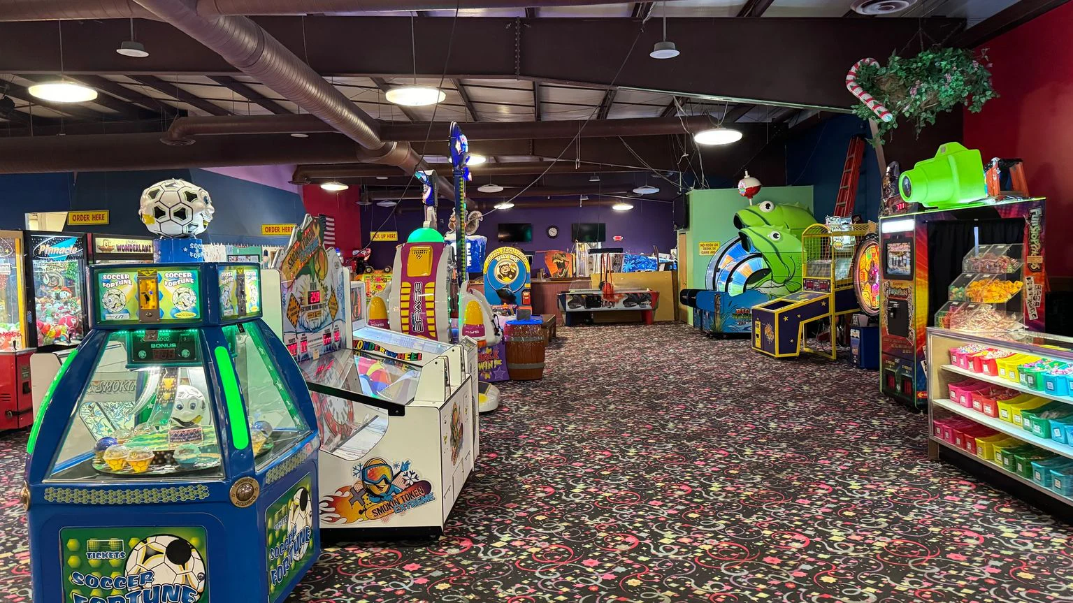 Colorful arcade and redemption games across the main floor at Billy Bob's Wonderland