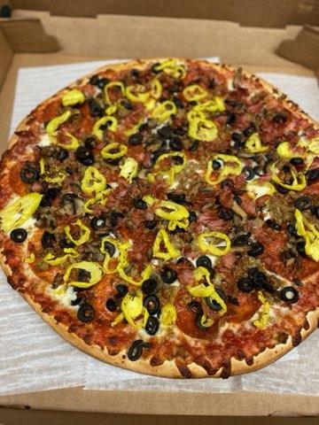 Pizza with black olives and banana peppers