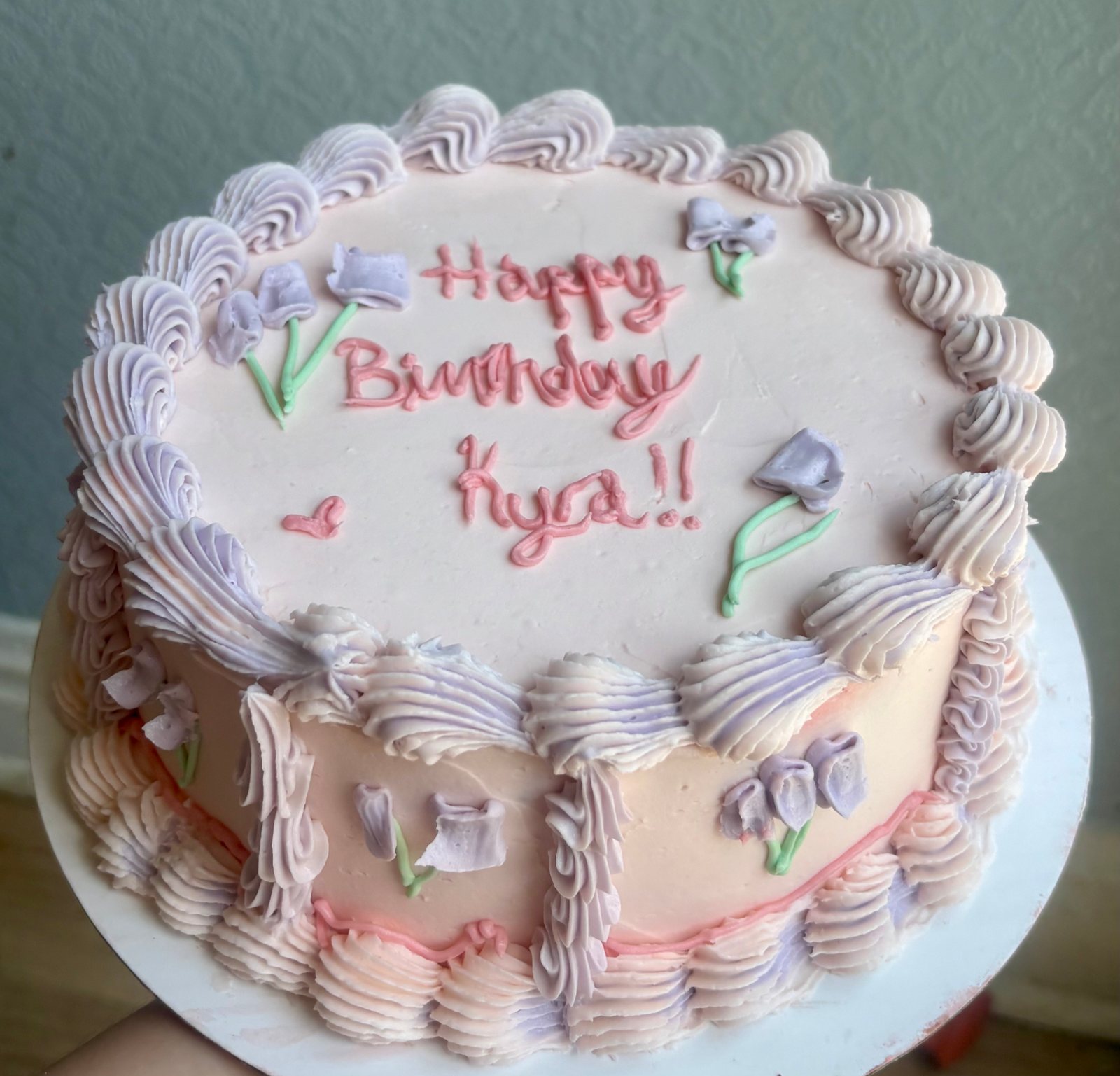 Pastel birthday cake with colorful piping