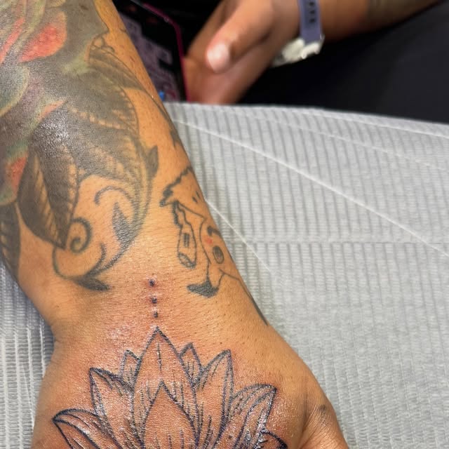Lotus tattoo by Derek Neal