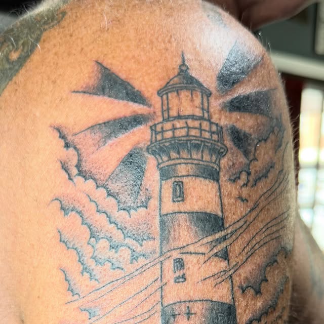 Blackwork lighthouse tattoo by Gabe Barker