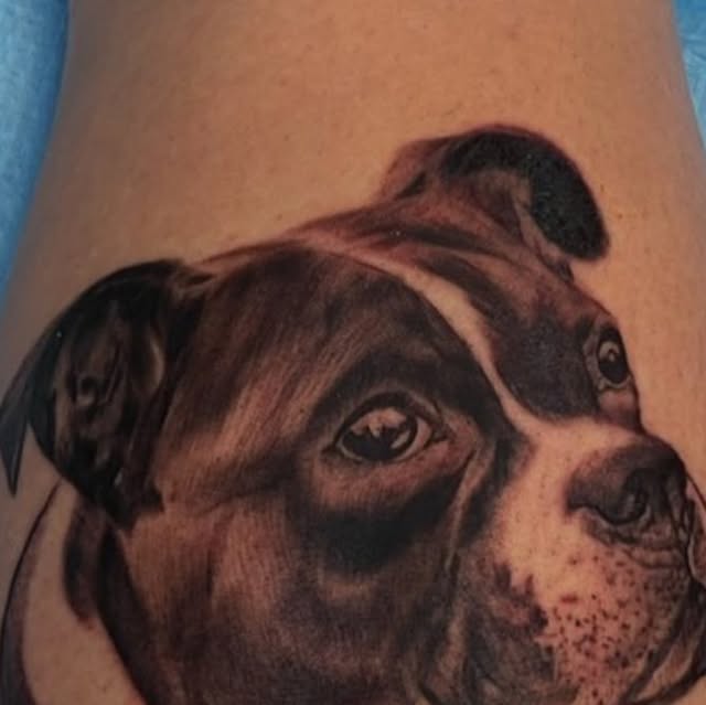 Realistic dog portrait tattoo by Ryan Worley