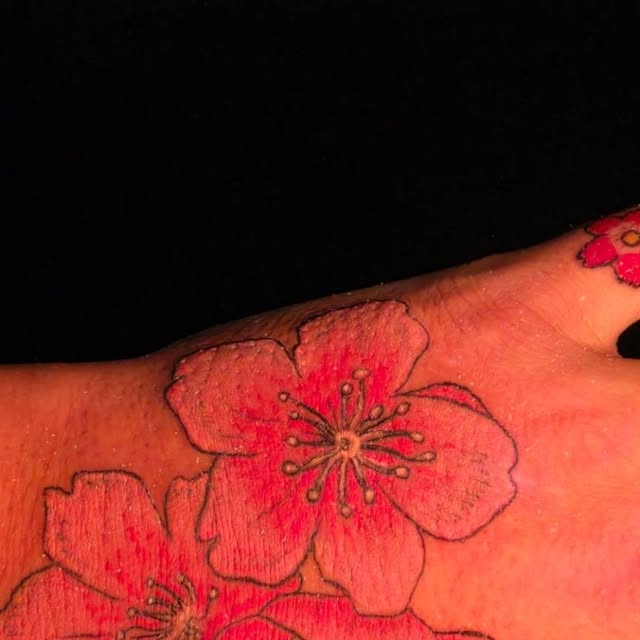 Sakura flower tattoo by TJ Young